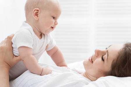 Portrait of happy mother and babyの写真素材