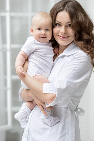 Portrait of happy mother and babyの写真素材