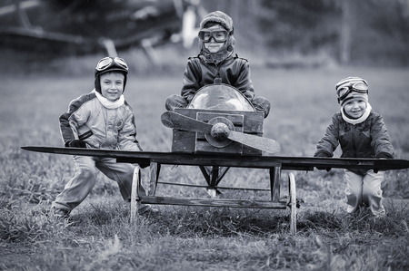 Young aviators at the airport with a homemade airplaneの写真素材