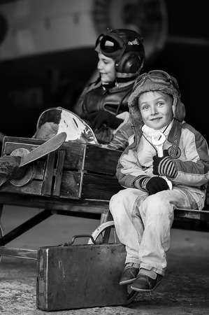 Young Aviators in a homemade aircraft in a hangar with these planesの写真素材