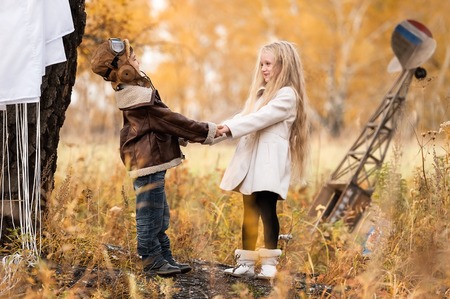 Meeting the young aviator with the girl in the field autumn clear dayの写真素材