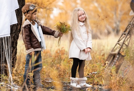 Meeting the young aviator with the girl in the field autumn clear dayの写真素材
