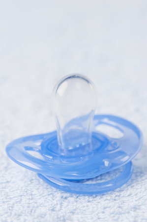 Baby's pacifier on bath towel