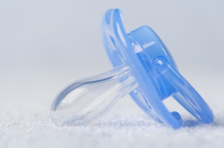 Baby's pacifier on bath towel