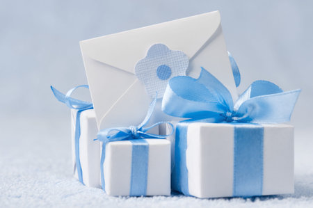 Gift boxes on a blue background with a letter-noteの写真素材