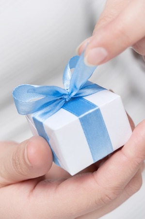 Small gift in female handsの写真素材