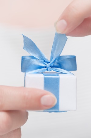 Small gift in female handsの写真素材