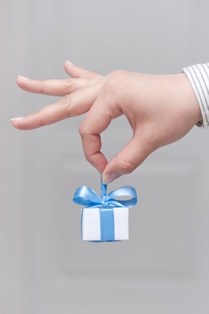 Small gift in female handの写真素材