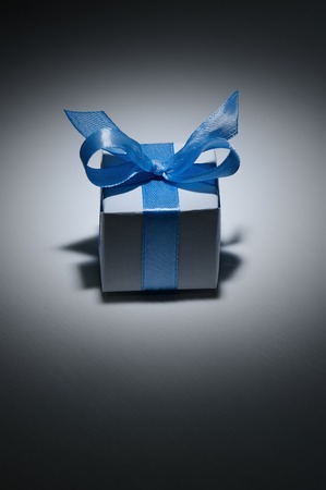 Box with gift on a black backgroundの写真素材