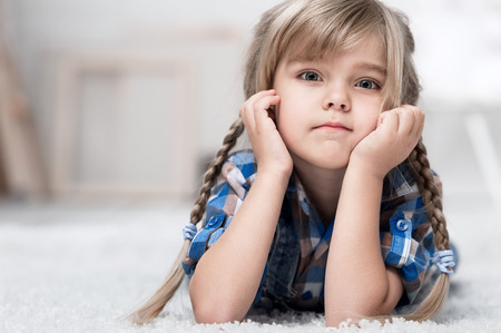 Portrait of a little girl in the interiorの写真素材
