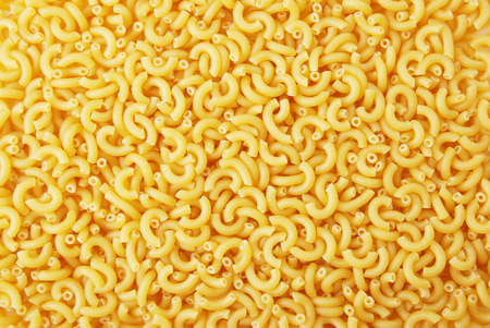 Background from figured yellow macaroniの写真素材