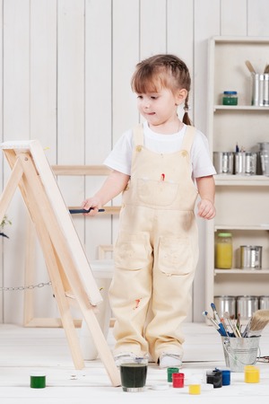 Little girl artist paints in studioの写真素材