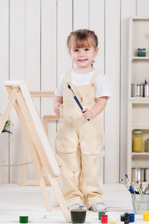 Little girl artist paints in studioの写真素材