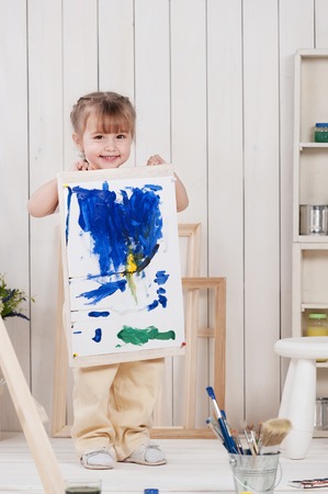Little girl artist paints in studioの写真素材