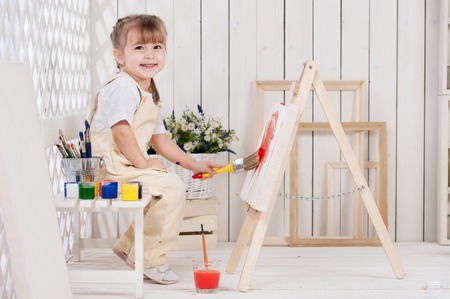 Little girl artist paints in studioの写真素材