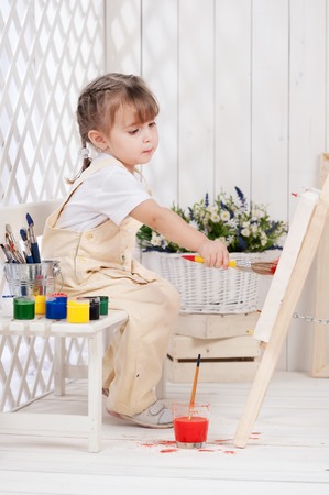 Little girl artist paints in studioの写真素材