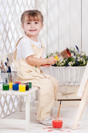 Little girl artist paints in studioの写真素材