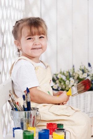 Little girl artist paints in studioの写真素材