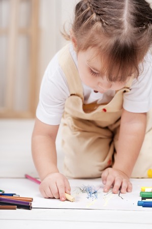 Little girl artist paints in studioの写真素材