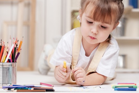 Little girl artist paints in studioの写真素材