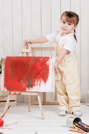 Little girl artist paints in his studioの写真素材
