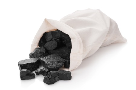 Coal in a bag on a white backgroundの写真素材