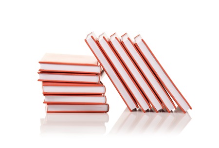Heap of books on a white backgroundの写真素材