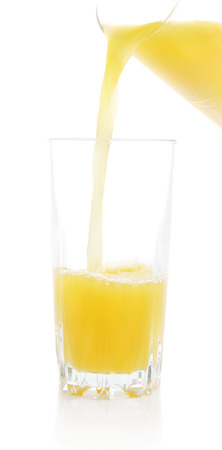 Glass with orange juice on a white backgroundの写真素材