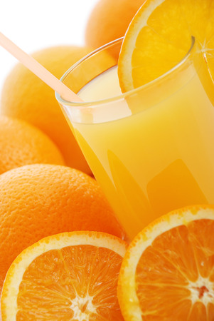 Glass with orange juice on a white backgroundの写真素材