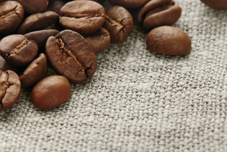 Coffee beans on a hessianの写真素材