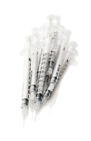 Heap insulinic syringes on a white backgroundの写真素材