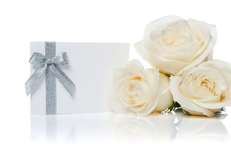 Bouquet of white roses on a white backgroundの写真素材