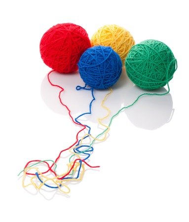 Color woolen clews for knitting on a white backgroundの写真素材