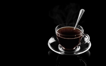 Cup of hot coffee on a black backgroundの写真素材