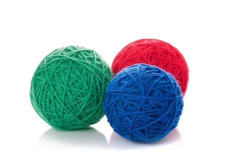 Color woolen clews for knitting on a white backgroundの写真素材