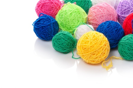 Color woolen clews for knitting on a white backgroundの写真素材