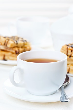 Cup of tea with a slice of cakeの写真素材