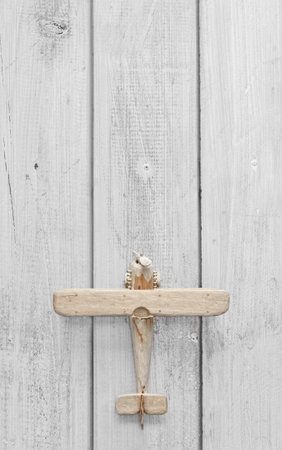 Wooden toy plane on the wooden floorの写真素材