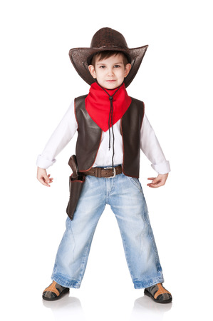 The little boy in a suit of the cowboy on a white の写真素材