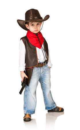 The little boy in a suit of the cowboy on a white の写真素材