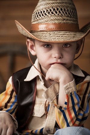 Portrait of a boy in a cowboy decorの写真素材