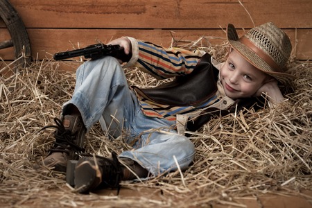 Portrait of a boy in a cowboy decorの写真素材