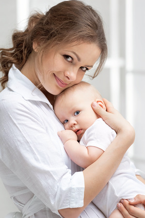 Portrait of happy mother and babyの写真素材