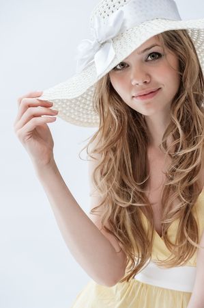 Portrait of a beautiful young girl on a white の写真素材