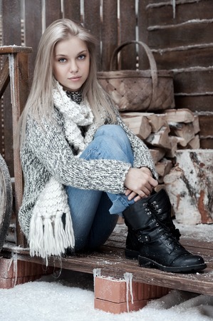Portrait of a young girl on the porchの写真素材