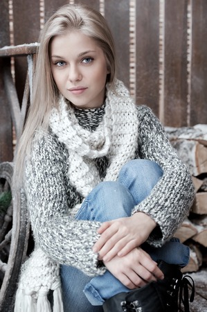 Portrait of a young girl on the porchの写真素材