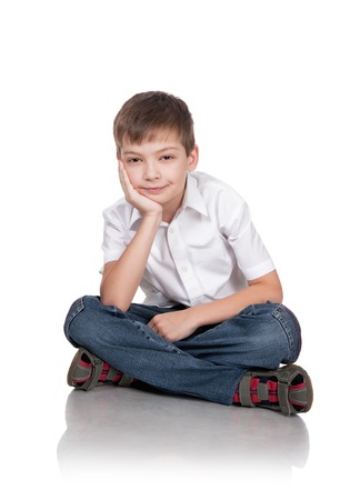 Portrait of the happy boy on a white backgroundの写真素材