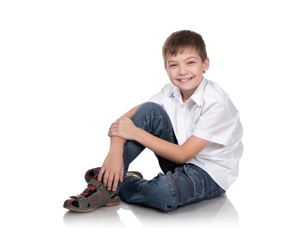 Portrait of the happy boy on a white backgroundの写真素材