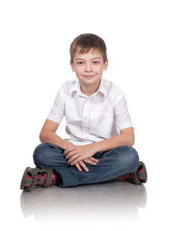 Portrait of the happy boy on a white backgroundの写真素材