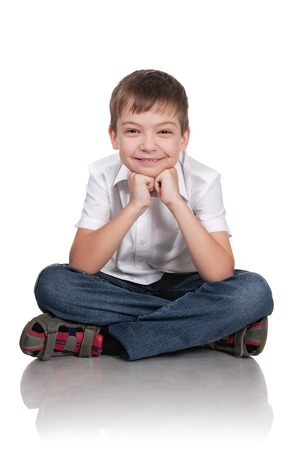 Portrait of the happy boy on a white backgroundの写真素材